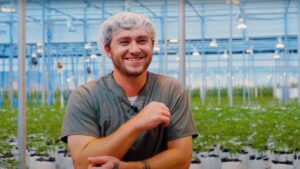 nuEra team member Andrew Robinson in front of grow operation