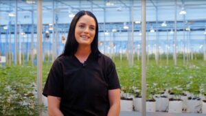 nuEra team member Annie White in front of grow operation